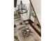 Inviting living room featuring a stone fireplace and elegant chandelier, perfect for gatherings at 670 Trinity Pl, Suwanee, GA 30024