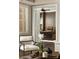 Transitional office space with dark wood furnishings, a leather chair and lots of natural light at 670 Trinity Pl, Suwanee, GA 30024