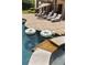 Relaxing backyard pool with lounge chairs and a view of the cascading waterfall at 670 Trinity Pl, Suwanee, GA 30024