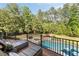 Outdoor deck overlooking pool and private backyard at 670 Trinity Pl, Suwanee, GA 30024