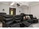 Home theater features luxurious leather reclining seating, ceiling mounted projector, and a cozy atmosphere at 670 Trinity Pl, Suwanee, GA 30024