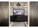Home theater featuring large screen, comfortable seating, and barn door entrance at 670 Trinity Pl, Suwanee, GA 30024