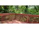 Back deck overlooking a backyard filled with lush trees and greenery at 1162 Sims St, Atlanta, GA 30310