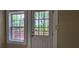 A back door and window shows a deck and green trees in the background at 1162 Sims St, Atlanta, GA 30310