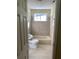 Cozy bathroom featuring tiled walls, updated fixtures, and a shower-tub combo at 1162 Sims St, Atlanta, GA 30310
