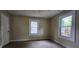 Bedroom with neutral carpet and paint with two windows at 1162 Sims St, Atlanta, GA 30310