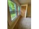 Bright bedroom features windows with a view and a closet with folding doors at 1162 Sims St, Atlanta, GA 30310