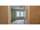 Bedroom view with neutral carpet, light green walls, ceiling fan, and good natural light from the window at 1162 Sims St, Atlanta, GA 30310