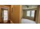 View of bedroom with natural light, ceiling fan, light green walls and neutral carpet at 1162 Sims St, Atlanta, GA 30310