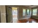 Charming entryway featuring hardwood floors, paneled walls and a view to the front yard at 1162 Sims St, Atlanta, GA 30310