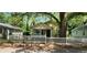 Charming cottage-style home featuring a picket fence, covered porch, and mature trees at 1162 Sims St, Atlanta, GA 30310