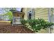 Charming home with a covered porch, mature landscaping, and updated window features at 1162 Sims St, Atlanta, GA 30310