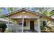 Cozy home with a welcoming covered porch and updated outdoor lighting at 1162 Sims St, Atlanta, GA 30310