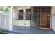 Front porch featuring secure iron bars and an open doorway leading into the home at 1162 Sims St, Atlanta, GA 30310