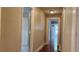 Bright hallway featuring hardwood floors and access to multiple rooms of the house at 1162 Sims St, Atlanta, GA 30310