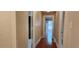 Long hallway with hardwood floors and classic trim provides access to various rooms at 1162 Sims St, Atlanta, GA 30310