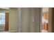 Hallway with a view of a bedroom and the kitchen featuring neutral wall paint at 1162 Sims St, Atlanta, GA 30310