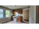 Bright kitchen with wood cabinets, updated appliances, laminate floors and natural light at 1162 Sims St, Atlanta, GA 30310