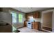 This kitchen features wood cabinets, an oven, and two windows for natural light at 1162 Sims St, Atlanta, GA 30310