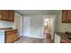 Kitchen featuring brown cabinets and countertops with access to the bathroom at 1162 Sims St, Atlanta, GA 30310
