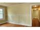 Living room with trim work, hardwood floors, and natural light from a window at 1162 Sims St, Atlanta, GA 30310