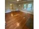 Light-filled living room with hardwood flooring and multiple windows at 1162 Sims St, Atlanta, GA 30310