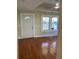 Inviting living room featuring beautiful hardwood floors, ample natural light, and classic trim detail at 1162 Sims St, Atlanta, GA 30310
