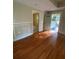 Spacious living room featuring hardwood floors and classic trim detail at 1162 Sims St, Atlanta, GA 30310