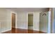 Bright living room featuring neutral paint, hardwood floors, and multiple open doorways at 1162 Sims St, Atlanta, GA 30310