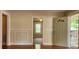 Living room featuring wainscoting details with an open entry door at 1162 Sims St, Atlanta, GA 30310