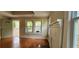 Living room includes hardwood floors, a non-operational fireplace and views of the front yard at 1162 Sims St, Atlanta, GA 30310