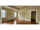 Living room features a non-operational fireplace, hardwood floors and multiple windows at 1162 Sims St, Atlanta, GA 30310