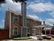 The brick home features a nice backyard patio and well-maintained landscaping, great for outdoor living at 1535 Justine Se Way, Mableton, GA 30126