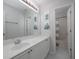Bright bathroom with a sink, shower/tub combo and neutral colored walls at 1535 Justine Se Way, Mableton, GA 30126