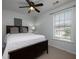 Comfortable bedroom featuring a ceiling fan and a bright window at 1535 Justine Se Way, Mableton, GA 30126