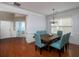 Bright dining room with hardwood floors, elegant chandelier, and a view into the foyer and office at 1535 Justine Se Way, Mableton, GA 30126