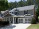 Charming two-story home with a well-manicured lawn, two-car garage, and attractive architectural details at 1535 Justine Se Way, Mableton, GA 30126