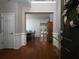 Inviting foyer with hardwood floors, detailed trim, and open view into the dining room and backyard at 1535 Justine Se Way, Mableton, GA 30126