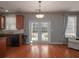 Bright kitchen with backyard view through French doors, wooden cabinets, and modern appliances at 1535 Justine Se Way, Mableton, GA 30126