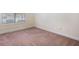 Bedroom features neutral walls, trim, and carpet with natural light at 1790 Piedmont Ln, Cumming, GA 30040