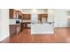 Kitchen with granite countertops, stainless appliances, and a breakfast bar at 1790 Piedmont Ln, Cumming, GA 30040