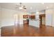 Open kitchen with granite countertops, stainless steel appliances, and hardwood floors at 1790 Piedmont Ln, Cumming, GA 30040
