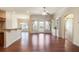 Open living room with hardwood floors, built-in shelving, and a view to the back yard at 1790 Piedmont Ln, Cumming, GA 30040