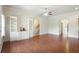 Open-concept living space with hardwood floors, built-ins, and staircase access at 1790 Piedmont Ln, Cumming, GA 30040