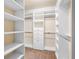 Organized walk-in closet with shelving, drawers, and ample storage space at 1790 Piedmont Ln, Cumming, GA 30040
