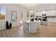 Breakfast nook featuring a round table, white chairs and an open view of kitchen and the side yard at 3064 Steinbeck Way, Atlanta, GA 30344
