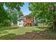 Spacious backyard featuring a wooden deck and lush lawn, ideal for entertaining and outdoor enjoyment at 596 Deadwood Trl, Locust Grove, GA 30248