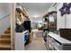 Organized basement area offering ample storage with shelves and easy access to the main living spaces at 596 Deadwood Trl, Locust Grove, GA 30248
