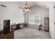 Bright, spacious bedroom with a sloped ceiling, a ceiling fan, and a large window at 596 Deadwood Trl, Locust Grove, GA 30248