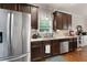 Well-appointed kitchen with stainless steel appliances, granite countertops, and dark wood cabinetry at 596 Deadwood Trl, Locust Grove, GA 30248